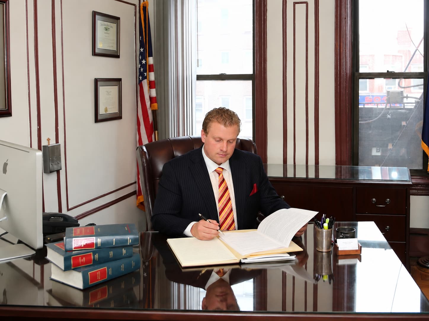 Interior of the Bay Ridge law office of Michael L. Walker, with New York statute volumes on the desk